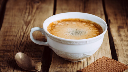Frothy coffee and chocolate chip cookies