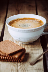 Frothy coffee and chocolate chip cookies