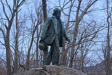  Lifelike bronze statue of great American poet Walt Whitman atop a boulder on the Appalachian Trail in Bear Mountain State Park.