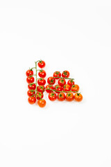 bunches of cherry tomatoes on white table