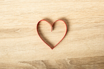 Composition Valentine's Day. Heart on a wooden background. Banner. Flat lay, top view