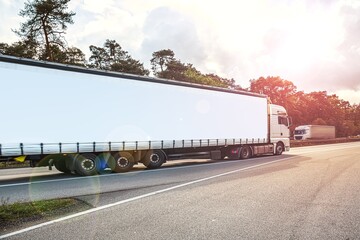 Motion blurred trucks on highway.   Logistics and transportation