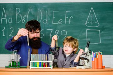 laboratory research and development. Innovation holds the key. Back to school. father and son at school. science camp. Chemistry beaker experiment. teacher man with little boy. School education