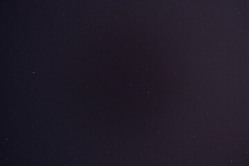 Night starry sky with a lot of stars and constellations in the city.