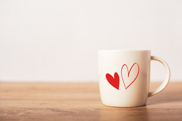 Festive composition for Valentine's Day. Mug with a heart. A gift to your beloved. Banner