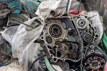 Disassembled motorcycle engine. Motorcycle powertrain parts under repair.