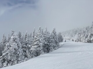 View to ski slopes with lot of fresh powder snow at Stowe Mountain resort VT in early December
