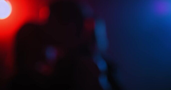 Portrait, beautiful couple of man and woman dancing in a dark studio with smoke. Silhouette of a man and a woman dancing tango, passion and love. 4k, ProRes