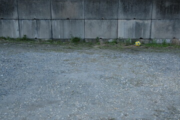 A lonely vacant lot and a soccer ball