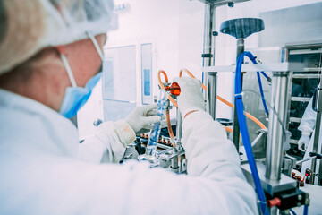 Medical staff in the laboratory. Testing a sample of liquid from a test tube.