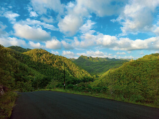 Road, Hill, and Blue Skies