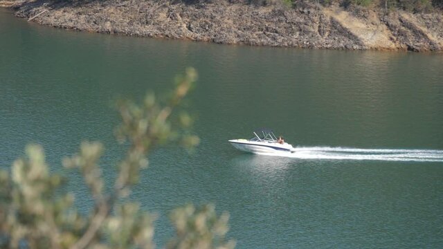 small motor boat cruising in river slow motion