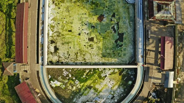 Drone Over Abandoned Resort And Pool In Forest
