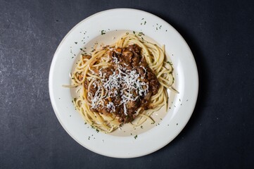 Spaghetti is a type of paste that is long, thin, cylindrical, and dense, which if noticed resembles noodles in general. It is a staple in traditional Italian cuisine. It's even better when given chees