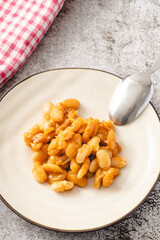 Baked beans organic homemade vegetarian and vegan dish traditional food on the table in ceramic plate - Serbian Montenegrin bosnian macedonian croatian slovenian and Bulgarian cuisine top view