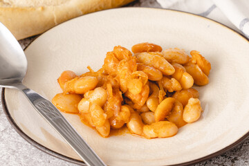 Baked beans organic homemade vegetarian and vegan dish traditional food on the table in ceramic plate - Serbian Montenegrin bosnian macedonian croatian slovenian and Bulgarian cuisine front view