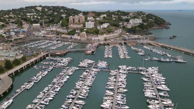 Boat Harbor Marina on Coastal Town of Torquay, England. Aerial Establishing