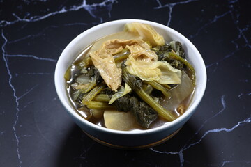 Classic boiled mix vegetable in Chinese style serving in the bowl. Famous vegetarian menu in Asia ancient ceremony or festival. Low fat and diet menu. 