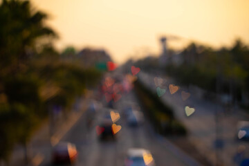 Defocused heart shape lights bokeh on traffic. 