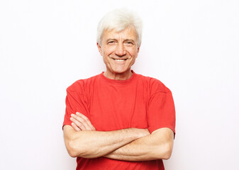 Portrait of healthy happy smile senior elderly caucasian old arm crossed with copy space isolated on white.