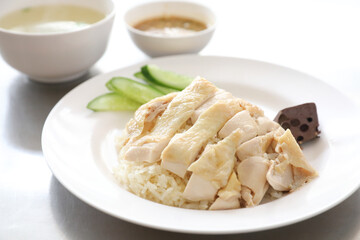 Thai food gourmet steamed chicken with rice khao mun kai in wood background