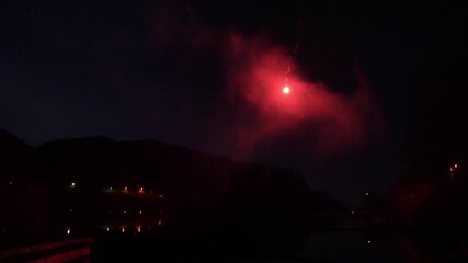 Distress signal rocket parachute flare red calling out help at Norway