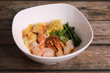 Shrimp dumpling with shrimp on wood background