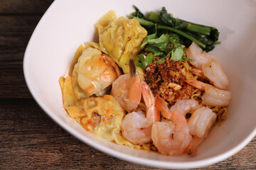 Shrimp dumpling with shrimp on wood background