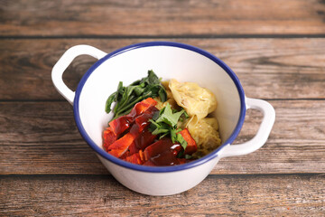 Shrimp dumpling with roasted pork on wood background