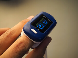 Picture of fingertip pulse oximeter that use for measuring oxygen saturation level on blood and also heart rate