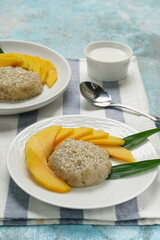Mango Sticky Rice with coconut milk as sweet dessert from Thailand 