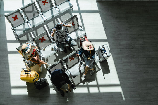 The Traveler Top Aerial View Of People With Bags And Suitcases Sit On The White Bench. Selective Focus