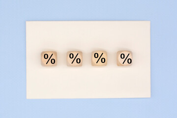 Percent sign on wooden cubes. Business concept