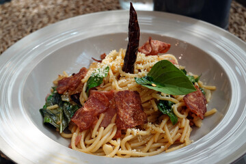 closeup. spaghetti with crispy bacon chili,garlic, basil, dried. 