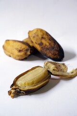 Grainy look of Pisang Rebus or Boiled Banana in white background. Pisang Kepok. Selective focus 
