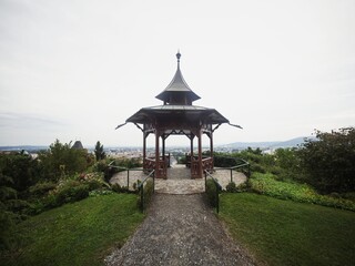 Panorama view of historic chinese pavilion on Schlossberg Castle Hill in city center Graz Styria Austria alps mountains