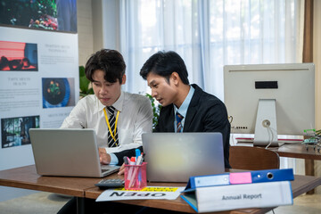 Asian business staff group present and working together,Kindly supervisor train new staff in office.