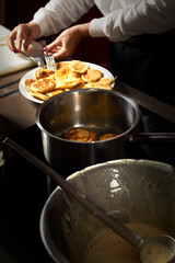 Cooking with pot and pancake preparation, body of a woman while cooking