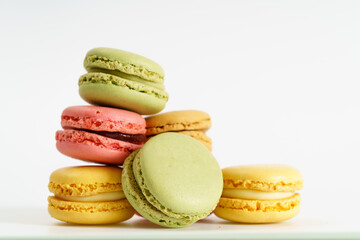 Colorful french macarons on background