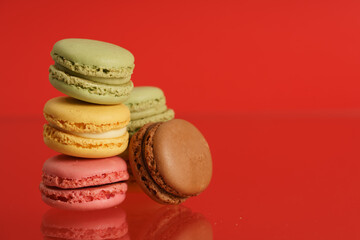 Colorful french macarons on background