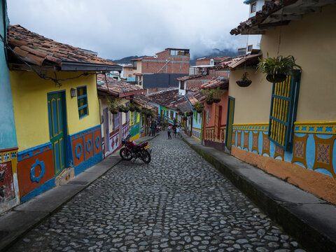 Cobblestone streets alley in picturesque colorful facades town village Guatape Pueblo de Zocalos in Antioquia Colombia