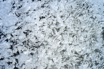 Ice patterns on a frozen river in winter