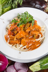 Appetizing goulash on a large plate. Restaurant serving concept. Close-up.