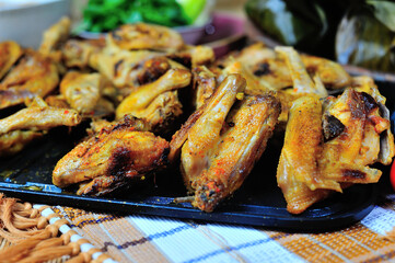 This is Ayam Bakar or Ayam Panggang. Ayam Bakar is one of the favorite dishes in Indonesia. Half-cooked chicken with spices then grilled over charcoal