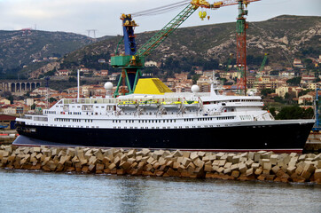 Classic old cruiseship or cruise ship liner in dry dock modernisation for repair, maintenance or...