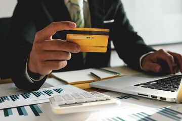 Close up of Hands holding credit card and using smartphone. Online shopping