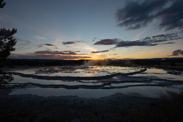Fototapeta na wymiar Reflection of Great Fountain Geyser at Sunset, Yellowstone National Park