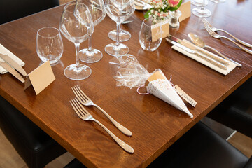 Beautiful decorated wooden party dinner wedding table