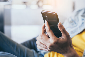 work using cell phone hand holding mobile texting message contact us.chatting,search internet information in office.technology device communication connecting