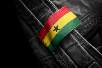 Tag on dark clothing in the form of the flag of the Ghana
